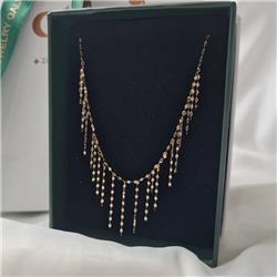 Gold-tassel-necklacE