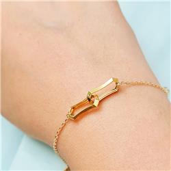 Hermes-Curved-Gold-Bracelet